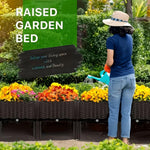Lifestyle image of a person watering a row of brown woven-style raised planters filled with bright flowers in a garden setting.