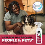 Smiling person kneeling next to a dog with a STEM spray bottle and a 'safe for use around people & pets' badge