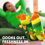 Relaxed person reclining with colorful striped socks and floating orange flowers suggesting Gain Island Fresh scent