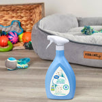 Blue Great Value Pet Odor Eliminator spray bottle placed on a floor in front of a pet bed and toys in a home setting