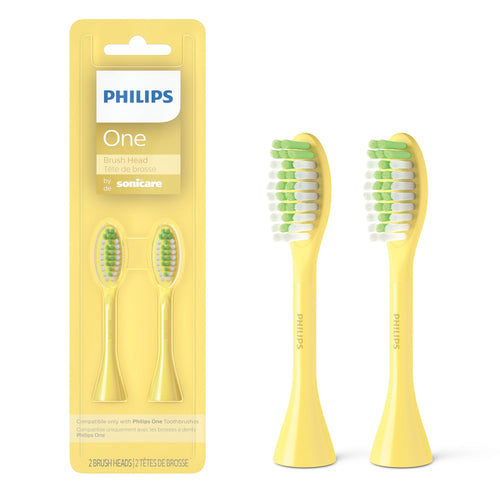 Yellow Philips One by Sonicare two-pack brush heads shown in blister pack and two loose yellow replacement heads