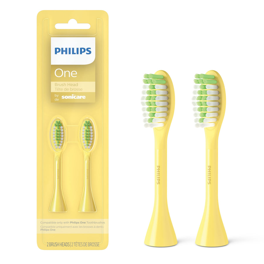 Yellow Philips One by Sonicare two-pack brush heads shown in blister pack and two loose yellow replacement heads