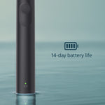 Cropped view of a black Philips Sonicare handle standing on water with a battery icon and text indicating 14-day battery life.