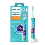 Philips Sonicare For Kids turquoise electric toothbrush and its retail box with playful purple character artwork.