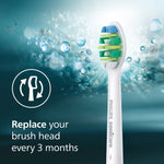 Single Philips Sonicare InterCare replacement brush head against a bubbly teal background with replace reminder