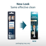 Graphic comparing old and new Philips Sonicare A3 brush head packaging with arrow and text noting 'New Look Same effective clean'.