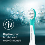 Turquoise-and-white Philips Sonicare kids brush head with bubbles and text advising to replace your brush head every 3 months