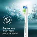 Single Philips Sonicare W DiamondClean brush head floating against a blue watery background with icon and text recommending replacement every 3 months.