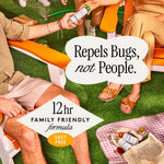 Lifestyle scene of people at a picnic with a hand passing a Grand Tongo spray can and overlay text about repelling bugs