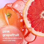 Close-up of sliced and whole pink grapefruits with bubbles, labeled ‘pink grapefruit’ scent description