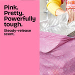 Close-up lifestyle image of a pink textured trash bag being filled, with bold pink panel reading 'Pink. Pretty. Powerfully tough.'