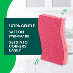 Close-up of a pink Scotch-Brite sponge with text callouts: extra gentle, safe on stemware, gets into corners