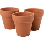 Three unpainted terra cotta flower pots arranged together on a white background