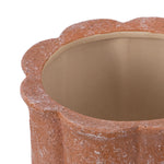Close-up of the planter rim and scalloped edge, showing textured terracotta finish and smooth inner glaze.