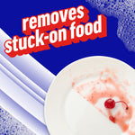Close-up of a plate with sticky food residue and a cherry, overlaid with 'removes stuck-on food' copy