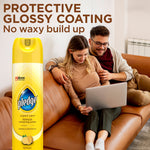 Pledge lemon aerosol can placed next to a couple on a leather couch with headline 'Protective Glossy Coating No waxy build up'