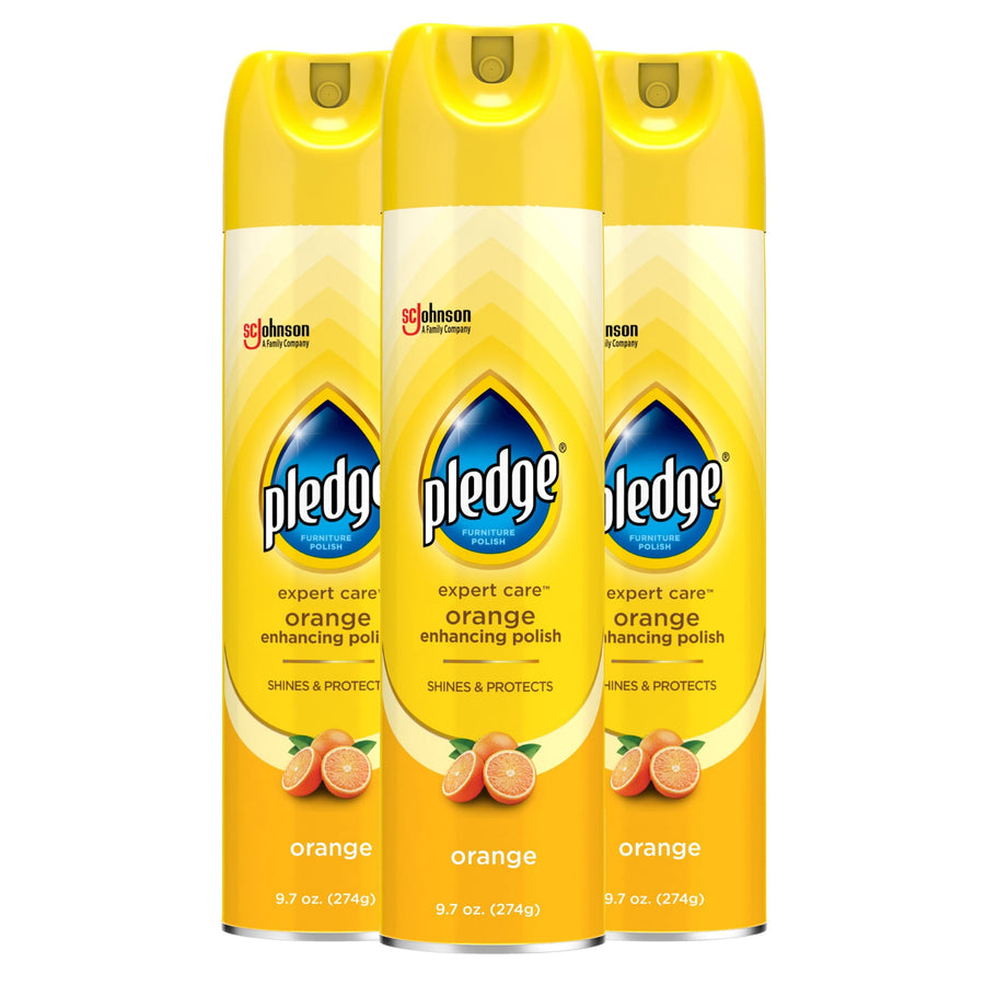 Three yellow Pledge Expert Care orange-enhancing aerosol cans shown side-by-side on white background.