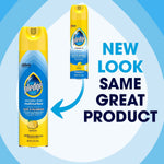 Promotional graphic showing Pledge multisurface lemon spray with text ‘NEW LOOK SAME GREAT PRODUCT’ and arrow between cans