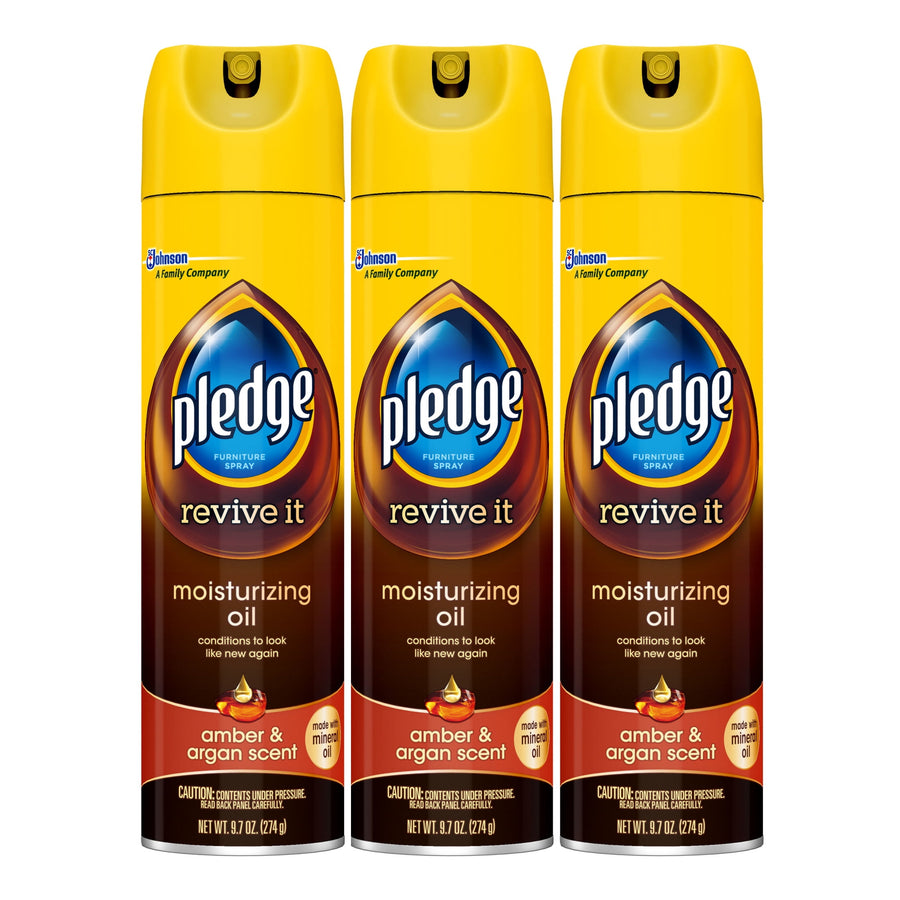 Three Pledge Revive It moisturizing oil spray cans in amber & argan packaging on white background