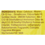 Close-up photograph of the ingredients panel printed on the back of a yellow Pledge wood wipes package