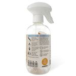 Rear view of a clear Podsy spray bottle showing usage instructions, icons, and product information on the label.