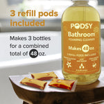 Close-up of Podsy Bathroom foaming cleaner bottle and three orange refill pods with text highlighting 'Makes 48 oz.'