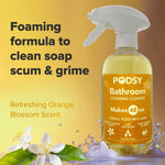 Podsy Bathroom foaming cleaner bottle on a stylized orange background with text about foaming formula and orange blossom scent.