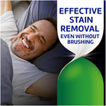 Marketing image showing smiling man and text promoting effective stain removal even without brushing for Polident