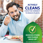Photo of a man eating with overlaid graphic stating 'Actively cleans even the hardest to reach places' and a 'removes stains' badge