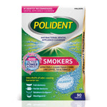 Front-facing Polident Smokers antibacterial dental appliance cleanser box with green background and visible 'Smokers' callout and tablet graphic