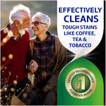 Older couple walking outdoors smiling with product text 'Effectively cleans tough stains like coffee, tea & tobacco' and a '#1 dentist recommended' badge