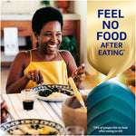 Happy woman dining at a table next to a gold panel reading 'FEEL NO FOOD AFTER EATING' as part of product branding.