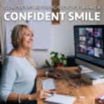 Smiling older woman at a desk in a lifestyle image with the headline confident smile, slightly blurred background