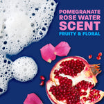 Pomegranate and rose petals beside sudsy foam with bold text "POMEGRANATE ROSE WATER SCENT" and descriptive subtext