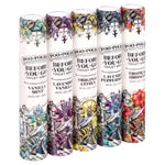 Row of five Poo-Pourri Before-You-Go travel spray tubes in assorted scents with colorful illustrated labels on white background