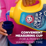 Close-up of a hand pouring blue liquid from a yellow Arm & Hammer Deep Clean detergent jug into a measuring cup with on-image copy