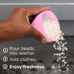 Hand pouring white scent booster beads from a pink scoop into a washer with usage steps listed.