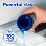 Hand pouring blue liquid detergent from a dosing cup into a washer drawer with a Purex 100 years emblem and 'Powerful clean' text
