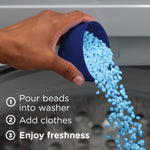 Hand pouring light-blue scent beads from a blue measuring cup into a washer with step text instructions visible