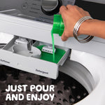 Hand pouring green liquid detergent from a Gain bottle into a washing machine detergent drawer with caption 'JUST POUR AND ENJOY'.