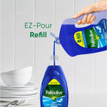 Hand pouring blue Palmolive Ultra Oxy from a large EZ-pour refill into a smaller pump bottle over white tiles