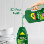 Hand pouring green Palmolive refill into an EZ-pump bottle with stacked dishes and tiled backsplash in the scene
