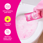 Close-up of a hand pouring a pink sachet into a toilet bowl producing self-activating pink foam, with feature icons at left.