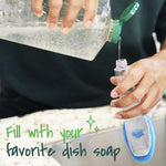 Close-up of hands pouring liquid soap into a translucent dishwand handle over a kitchen sink, text says fill with your favorite dish soap.