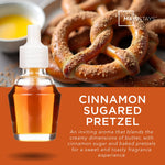 Promotional image showing a fragrance oil refill bottle in front of cinnamon-sugared pretzels and product name text