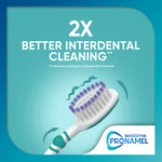 Graphic of a Pronamel toothbrush head with arrows showing improved interdental cleaning and headline text