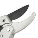 Close-up of black cutting blade and silver anvil/pruner jaw showing the blade edge and hinge area