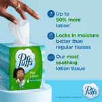 Hand pulling a tissue from a Puffs Plus Lotion cube box with text highlighting lotion and moisture-lock benefits