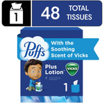 Blue cube box of Puffs Plus Lotion tissues featuring Vicks shield logo, child illustration and '48 total tissues' badge.