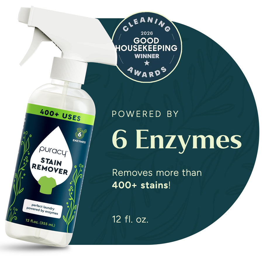 Spray bottle of Puracy Stain Remover next to a circular badge highlighting "Powered by 6 Enzymes" and Good Housekeeping award.